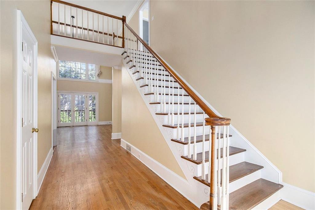 2520 Summeroak Drive Tucker, GA 30084 - Photo 5 of 37 a view of staircase with wooden floor and white walls