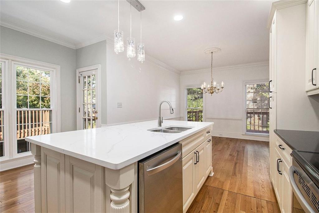 2520 Summeroak Drive Tucker, GA 30084 - Photo 9 of 37 a kitchen that has a sink a stove and a wooden floor