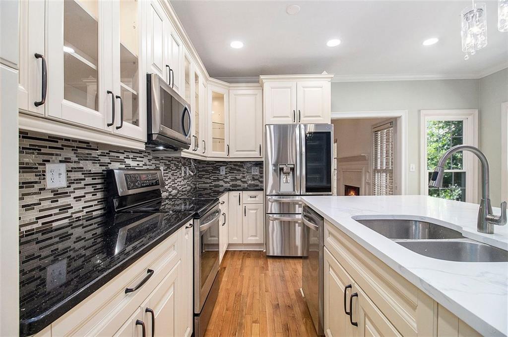 2520 Summeroak Drive Tucker, GA 30084 - Photo 10 of 37 a kitchen with a sink stove and cabinets