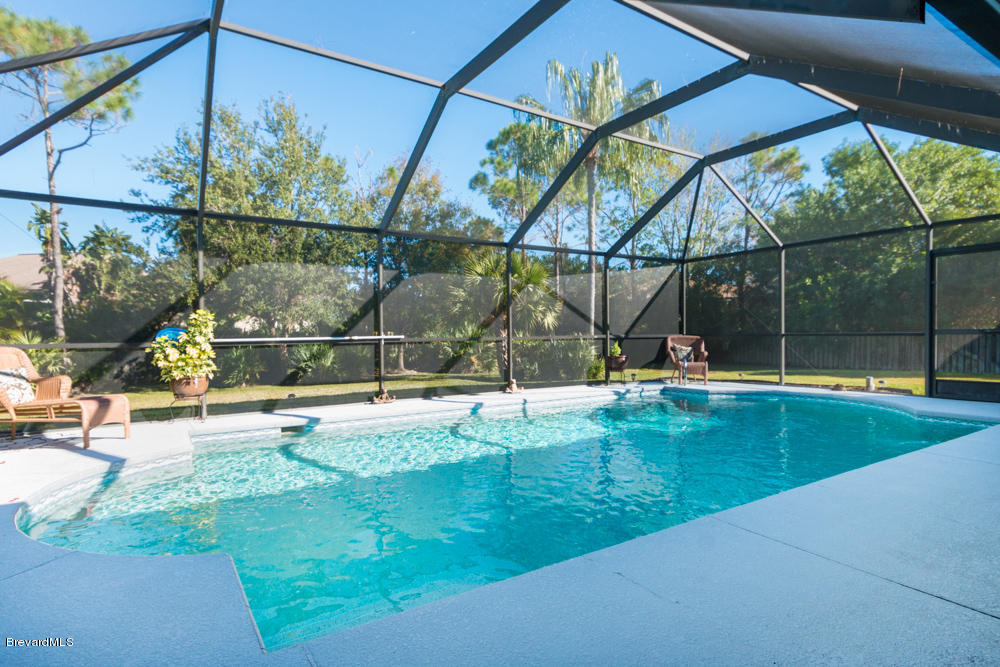 4696 Canard Road Melbourne, FL 32934 - Photo 2 of 19 SCREEN SALT WATER POOL