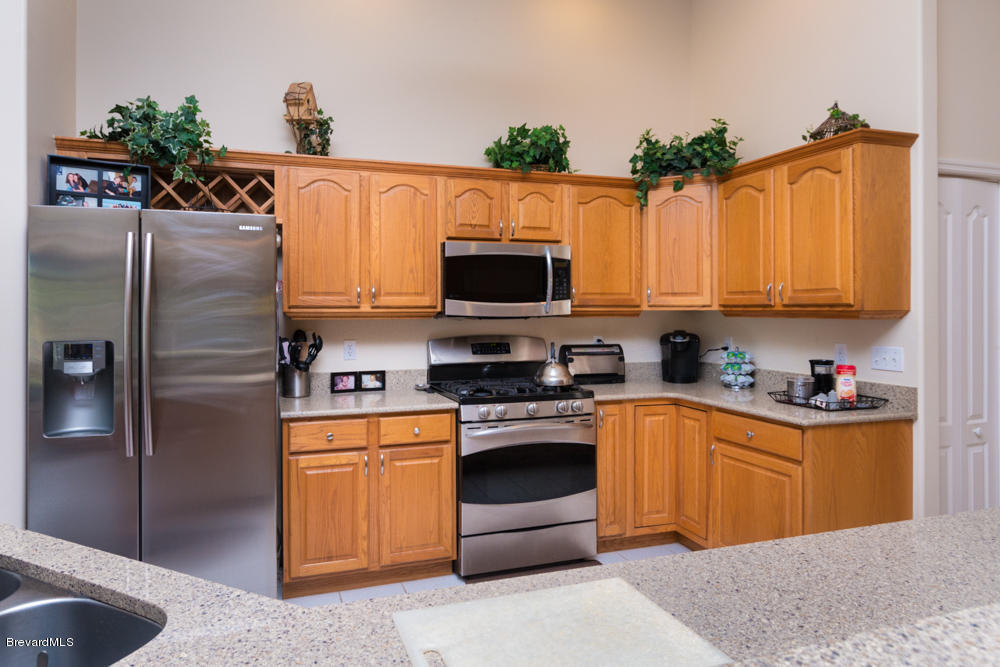 4696 Canard Road Melbourne, FL 32934 - Photo 3 of 19 KITCHEN,VIEW 1. QUARTZ COUNTERS