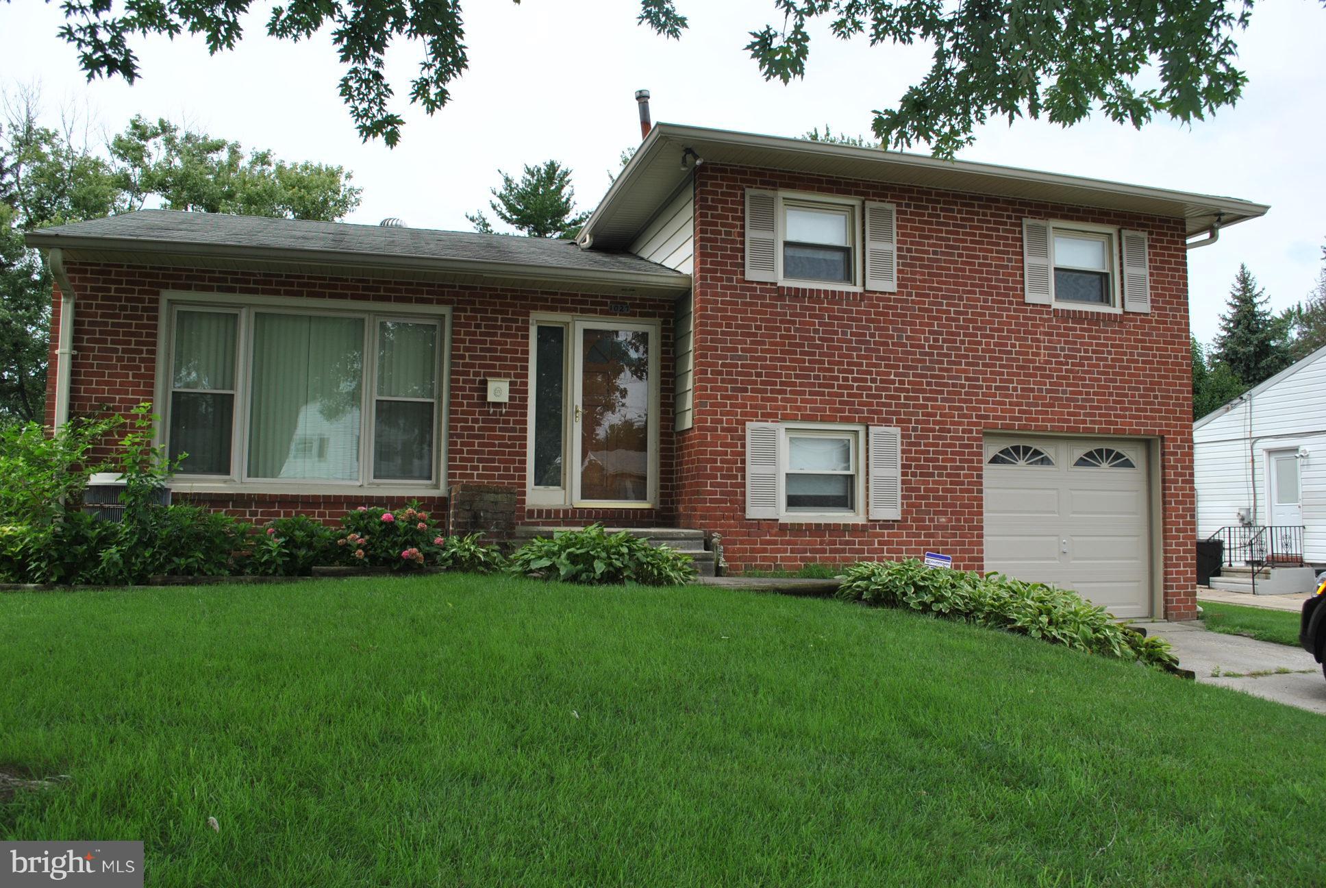 1027 Lakemont Road Baltimore, MD 21228 - Photo 1 of 14 a view of a house with garden