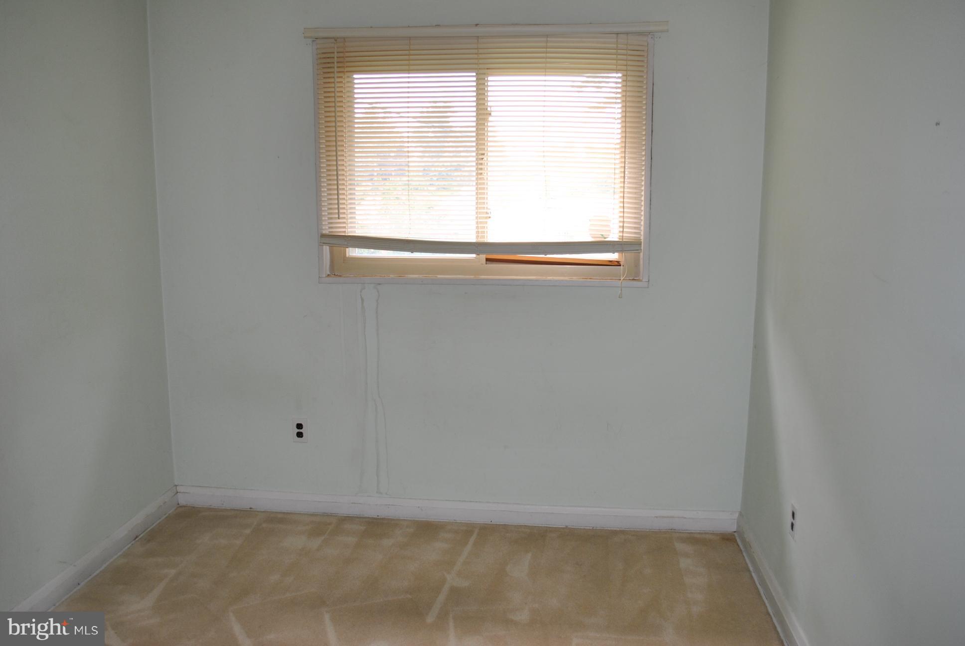1027 Lakemont Road Baltimore, MD 21228 - Photo 11 of 14 an empty room with a window