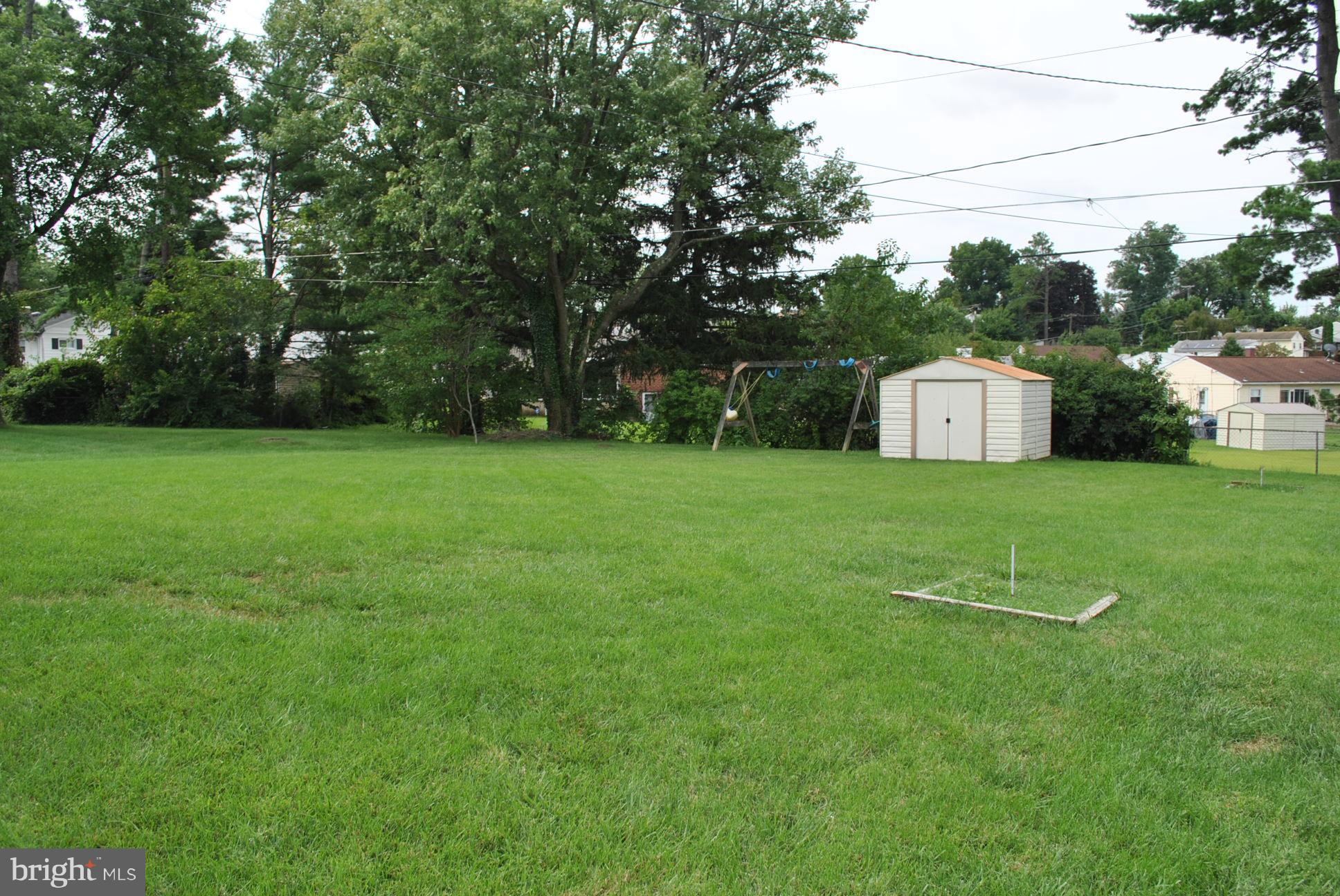 1027 Lakemont Road Baltimore, MD 21228 - Photo 3 of 14 a view of a house with a yard