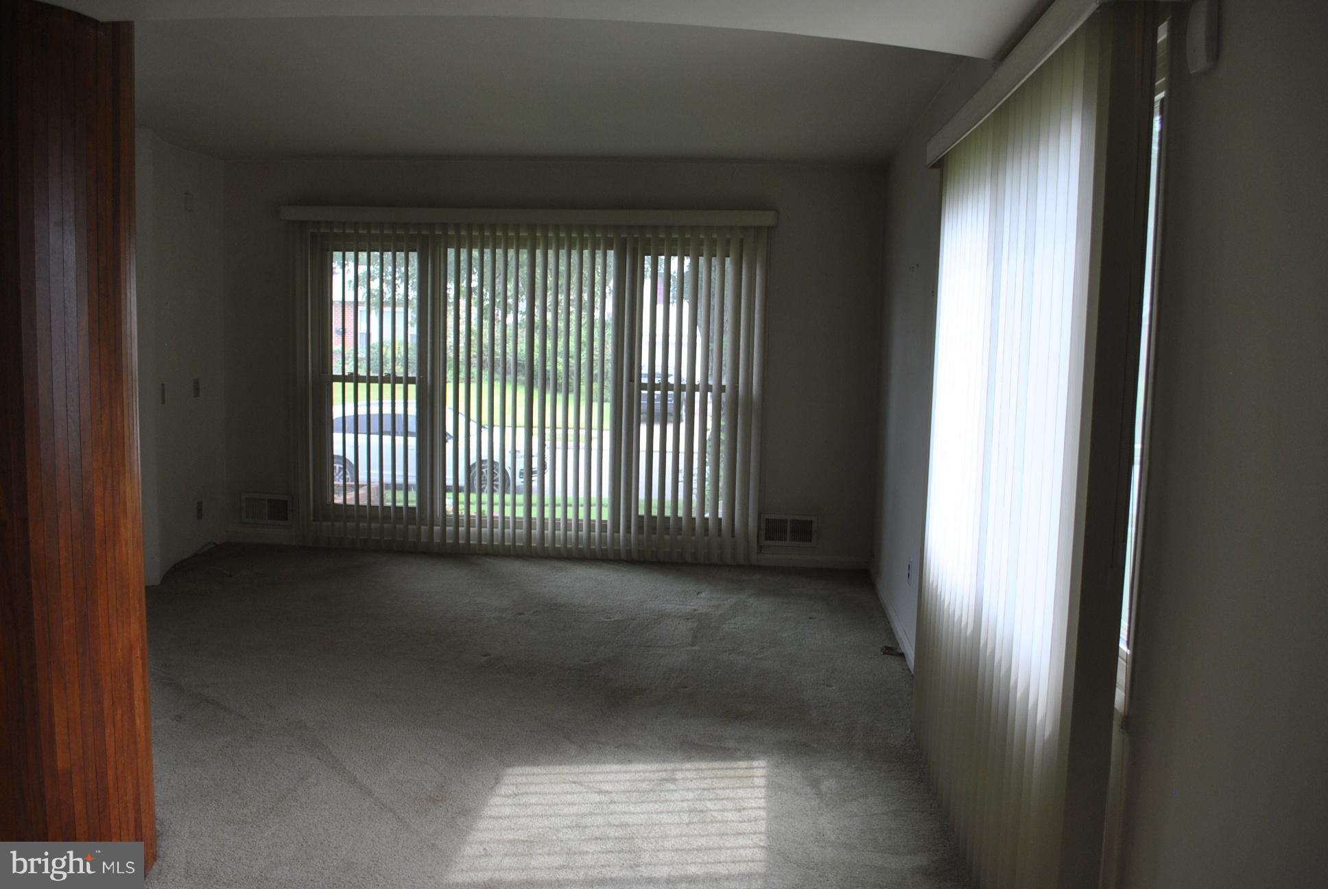 1027 Lakemont Road Baltimore, MD 21228 - Photo 7 of 14 a view of a big room with windows