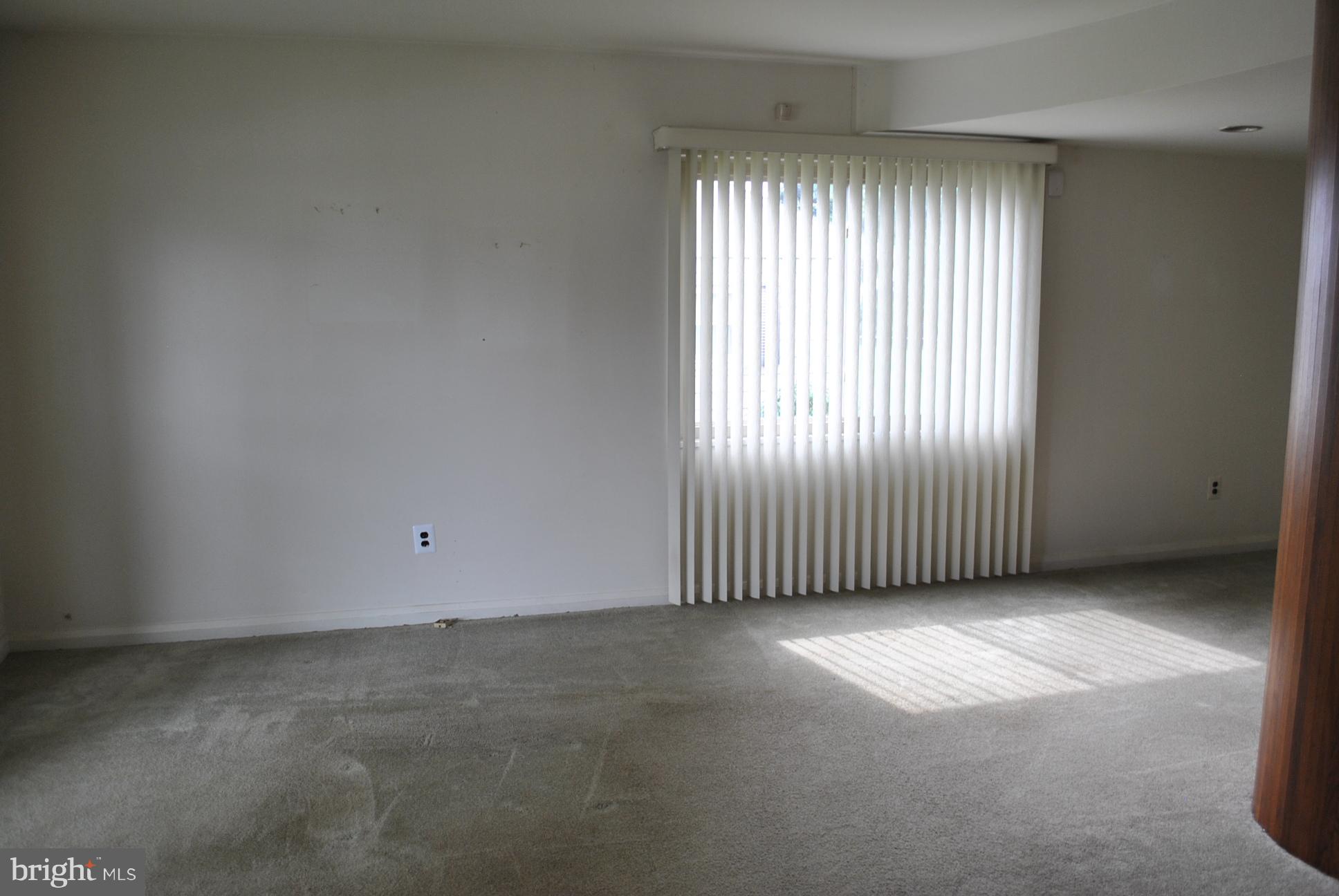 1027 Lakemont Road Baltimore, MD 21228 - Photo 8 of 14 an empty room with windows