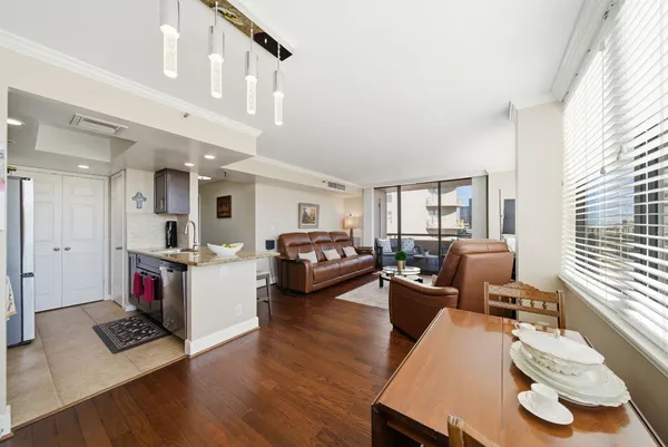a living room with furniture window and wooden floor
