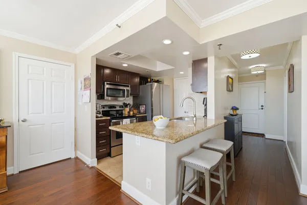 a kitchen with a table and chairs in it