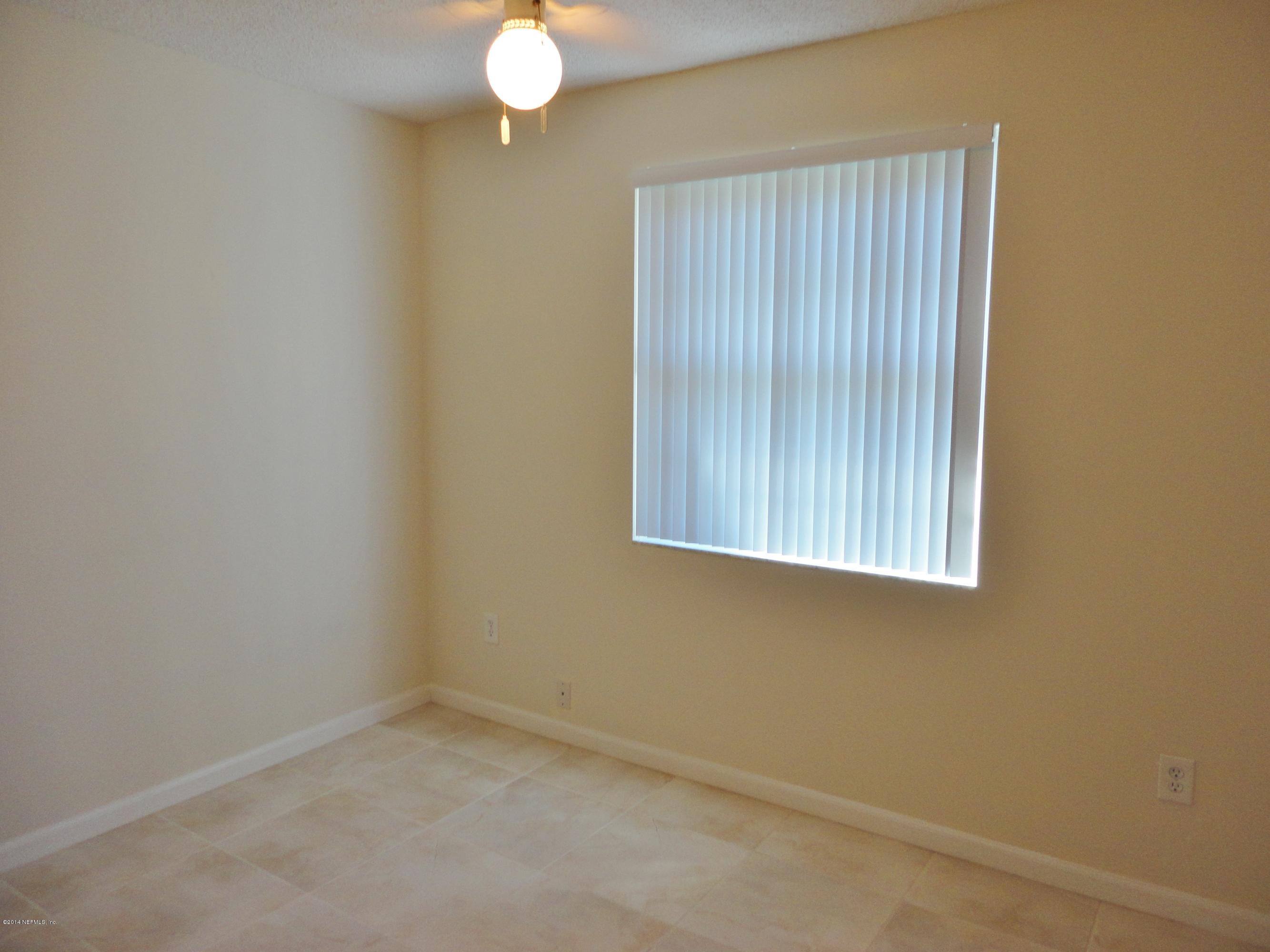 323 Gentian Road St. Augustine, FL 32086 - Photo 15 of 24 an empty room with windows