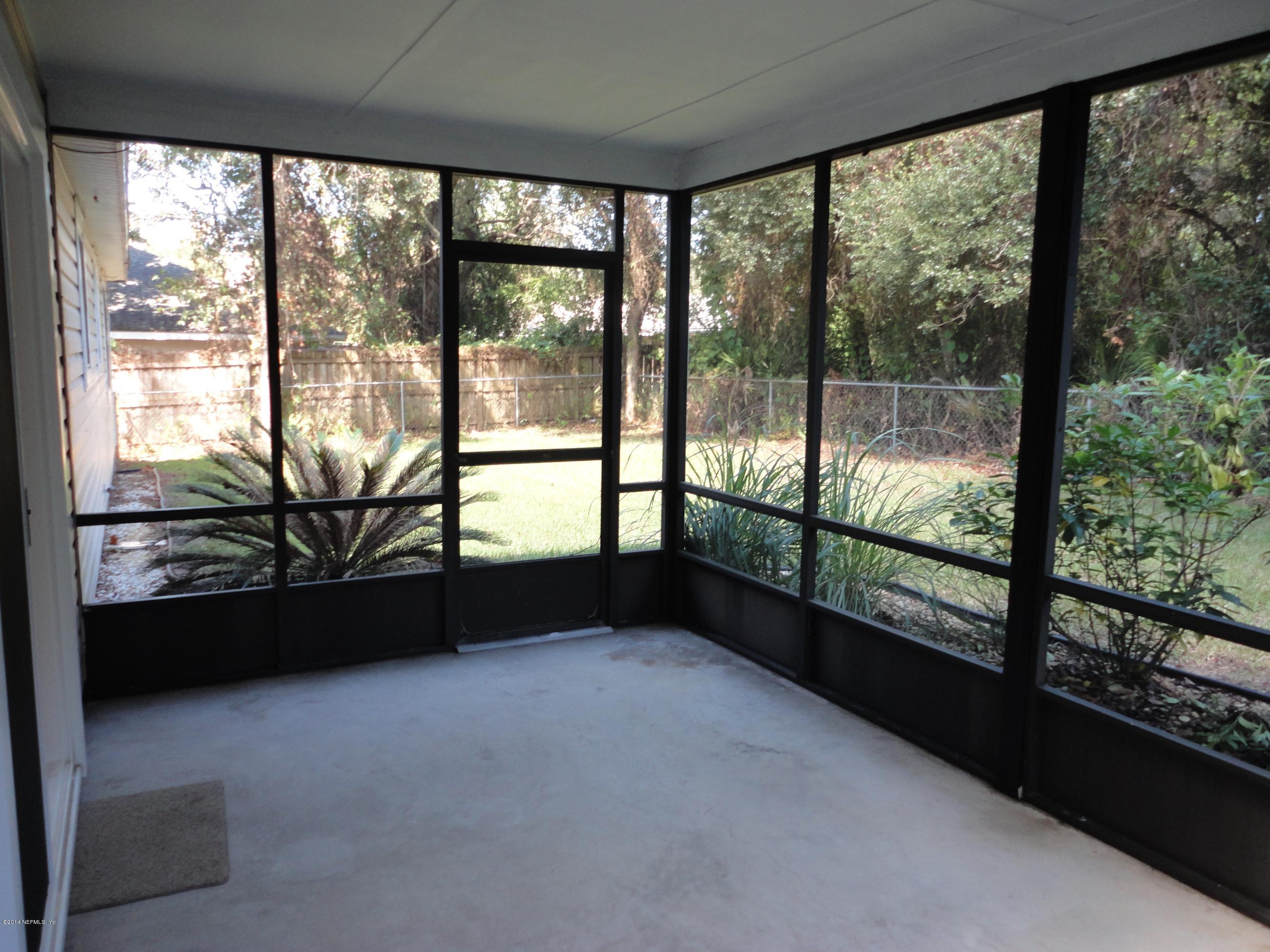 323 Gentian Road St. Augustine, FL 32086 - Photo 21 of 24 a view of empty room with large windows