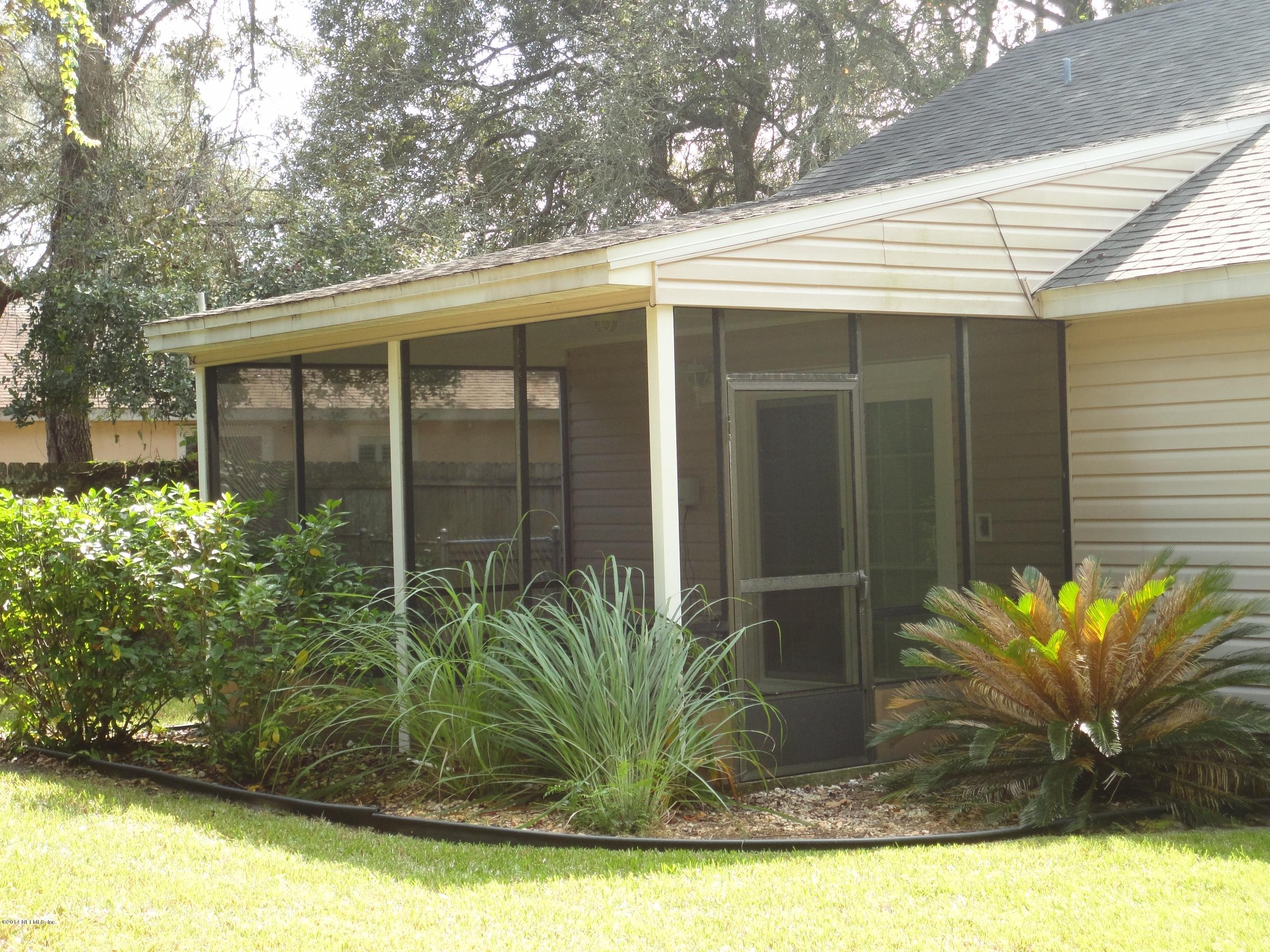 323 Gentian Road St. Augustine, FL 32086 - Photo 23 of 24 a view of a potted plants in front of a house