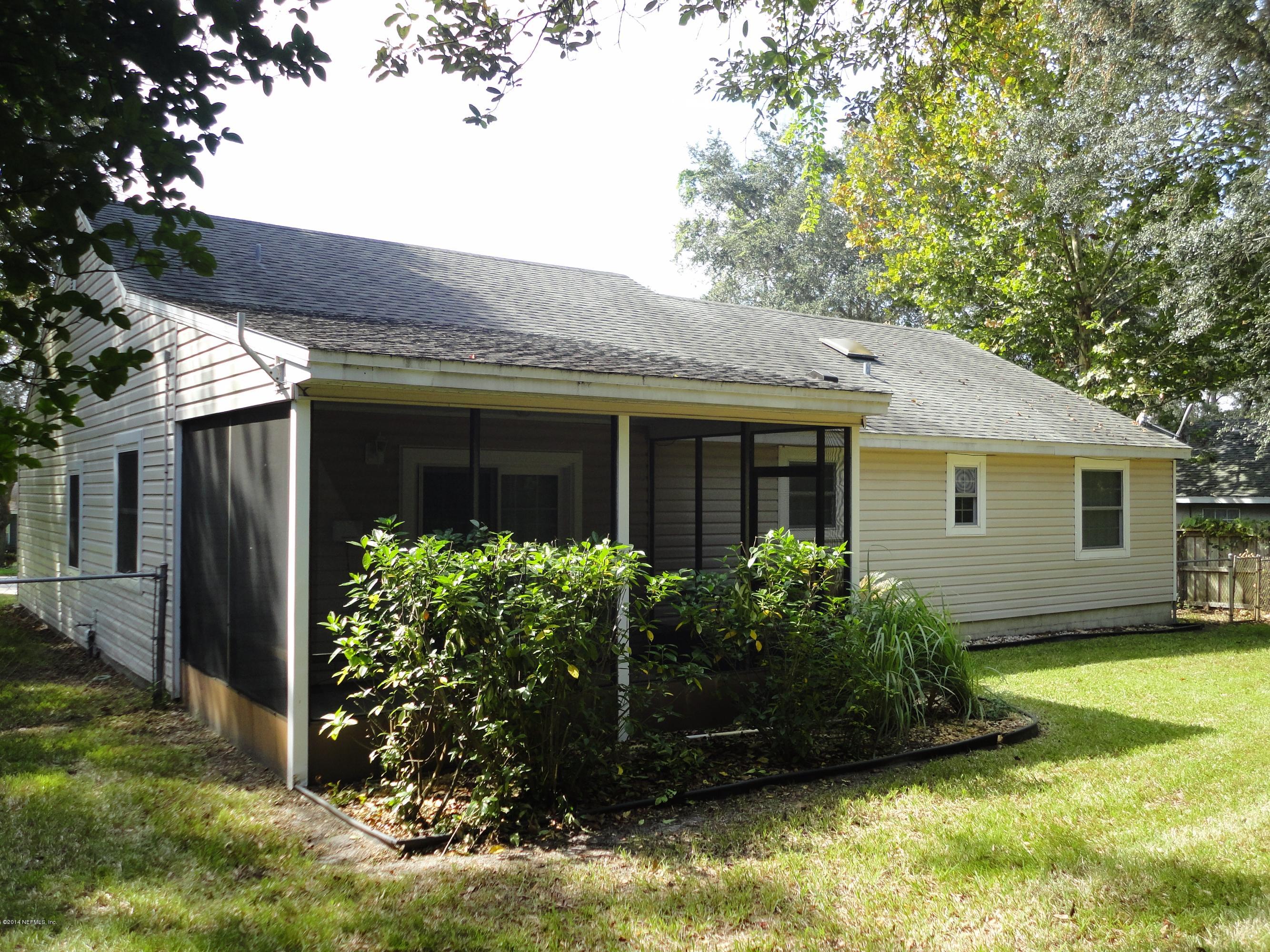 323 Gentian Road St. Augustine, FL 32086 - Photo 24 of 24 a view of a house with backyard and garden