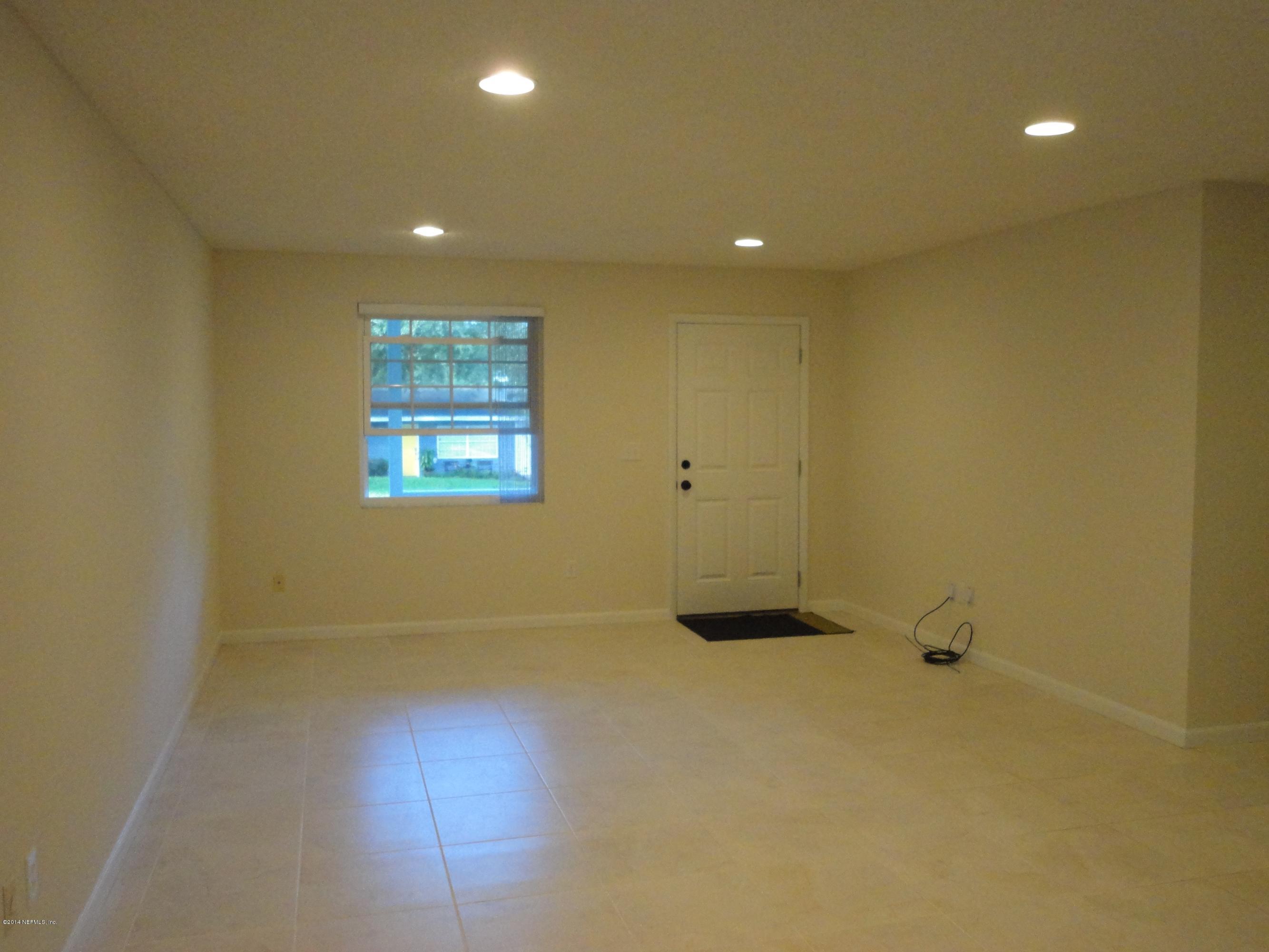 323 Gentian Road St. Augustine, FL 32086 - Photo 3 of 24 an empty room and a window