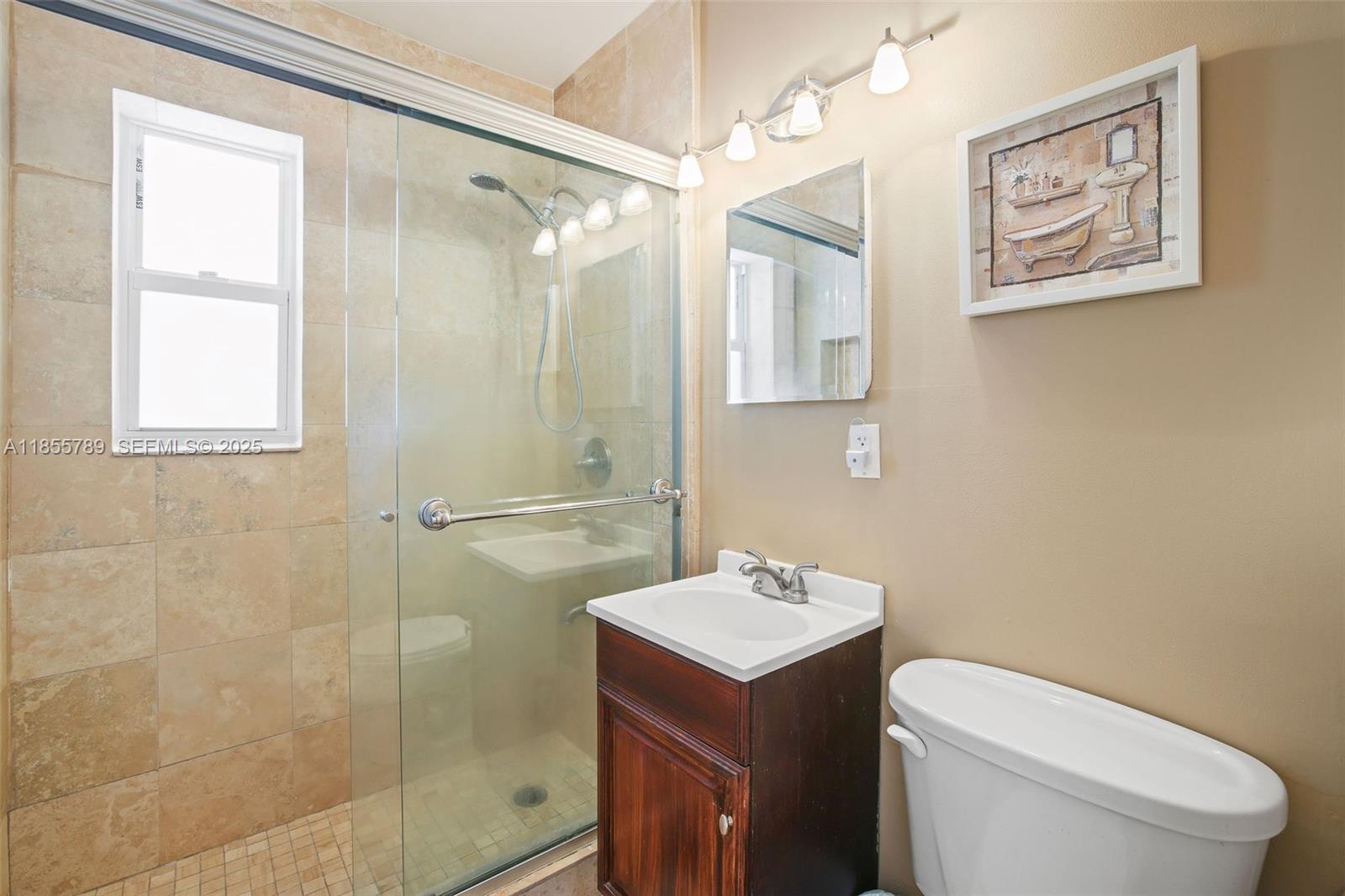 7550 Southwest 28th Street Road Miami, FL 33155 - Photo 18 of 27 a bathroom with a sink toilet and shower