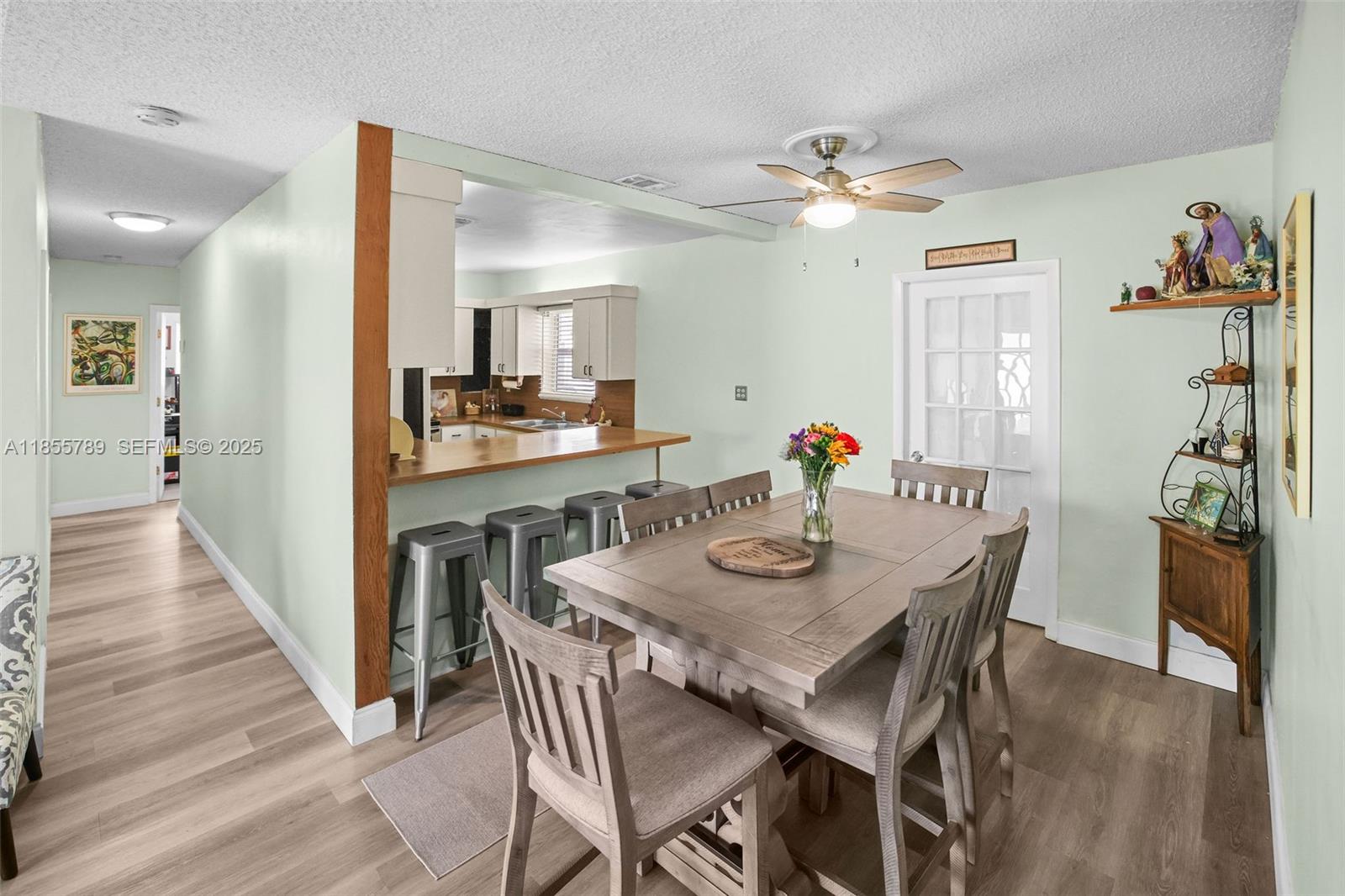 7550 Southwest 28th Street Road Miami, FL 33155 - Photo 4 of 27 a view of a dining room with furniture and wooden floor