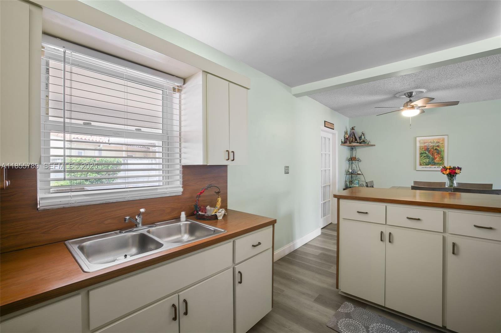 7550 Southwest 28th Street Road Miami, FL 33155 - Photo 10 of 27 a kitchen with a sink cabinets and window