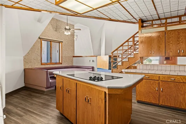 a view of entryway with wooden floor and stairs