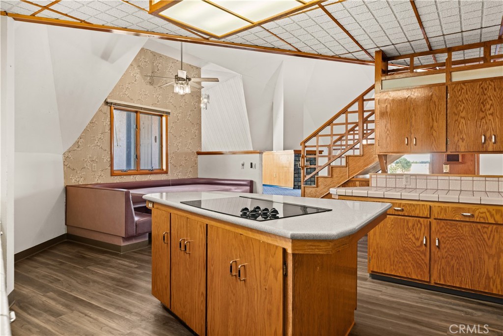 4345 Hall Road Corning, CA 96021 - Photo 13 of 52 a kitchen with stainless steel appliances granite countertop a sink stove and wooden floor