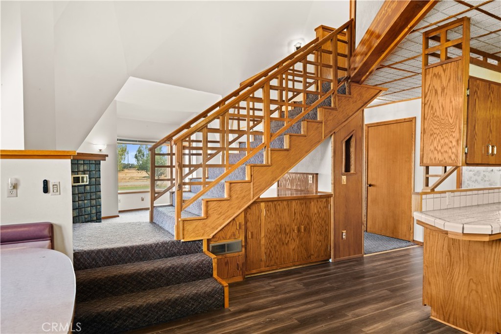 4345 Hall Road Corning, CA 96021 - Photo 14 of 52 a view of entryway with wooden floor and stairs