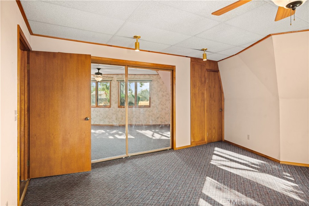 4345 Hall Road Corning, CA 96021 - Photo 16 of 52 a view of empty room with wooden floor and fan
