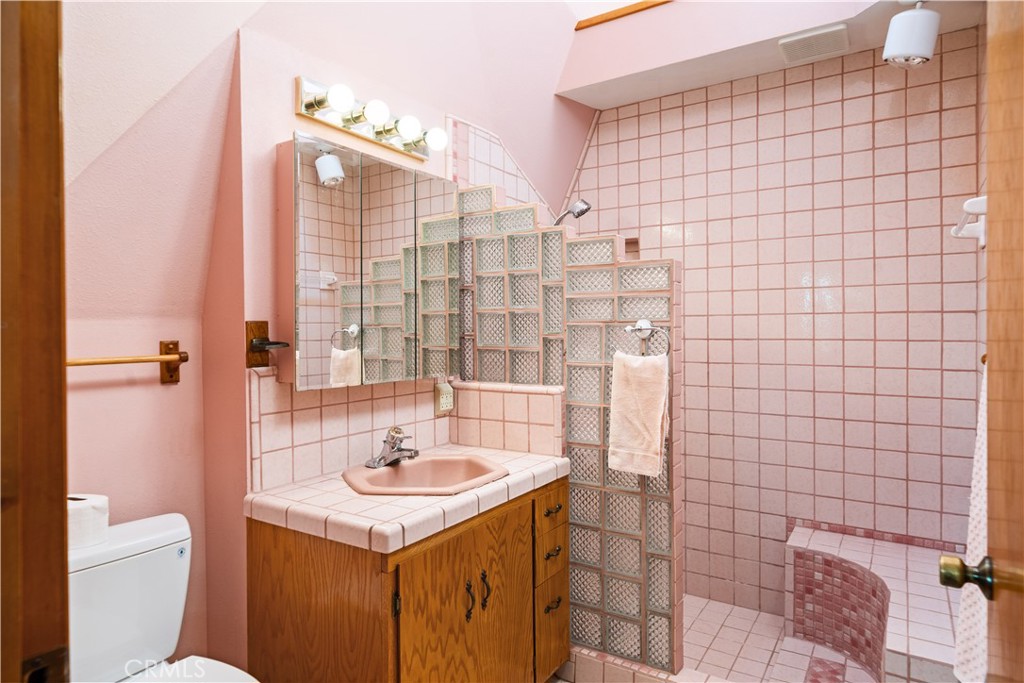 4345 Hall Road Corning, CA 96021 - Photo 18 of 52 a bathroom with a sink a toilet and shower