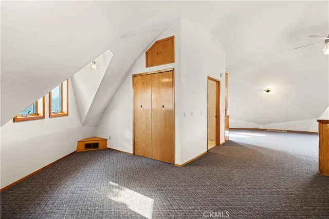 a view of walk in closet with wooden floor