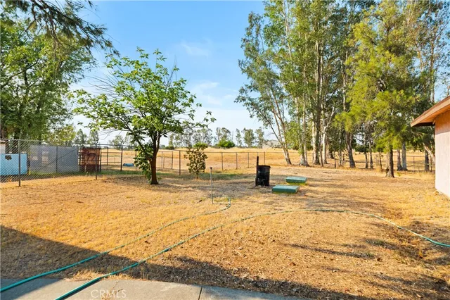 a view of yard with swimming pool