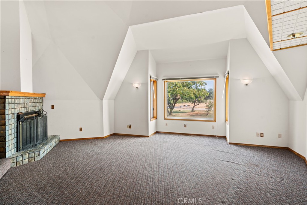 4345 Hall Road Corning, CA 96021 - Photo 5 of 52 a view of an empty room with a fireplace