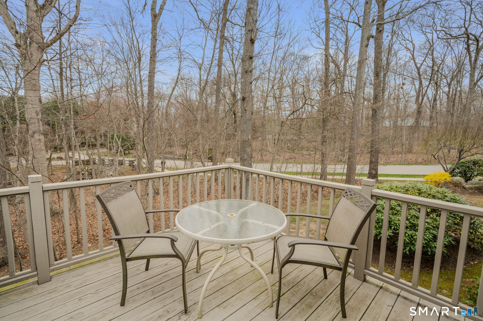 3 Bittersweet Lane, Unit 3 East Lyme, CT 06357 - Photo 12 of 36 Deck view of woods.