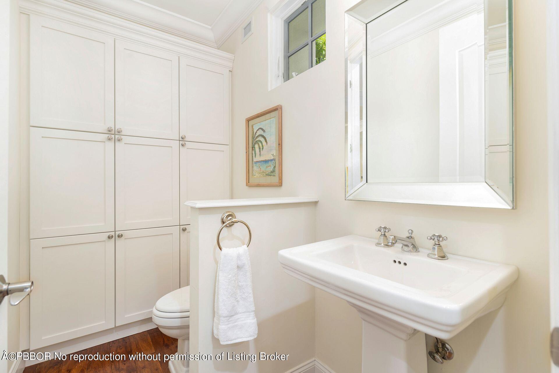 135 Root Trail, Unit A Palm Beach, FL 33480 - Photo 16 of 25 a bathroom with a sink a toilet and shower
