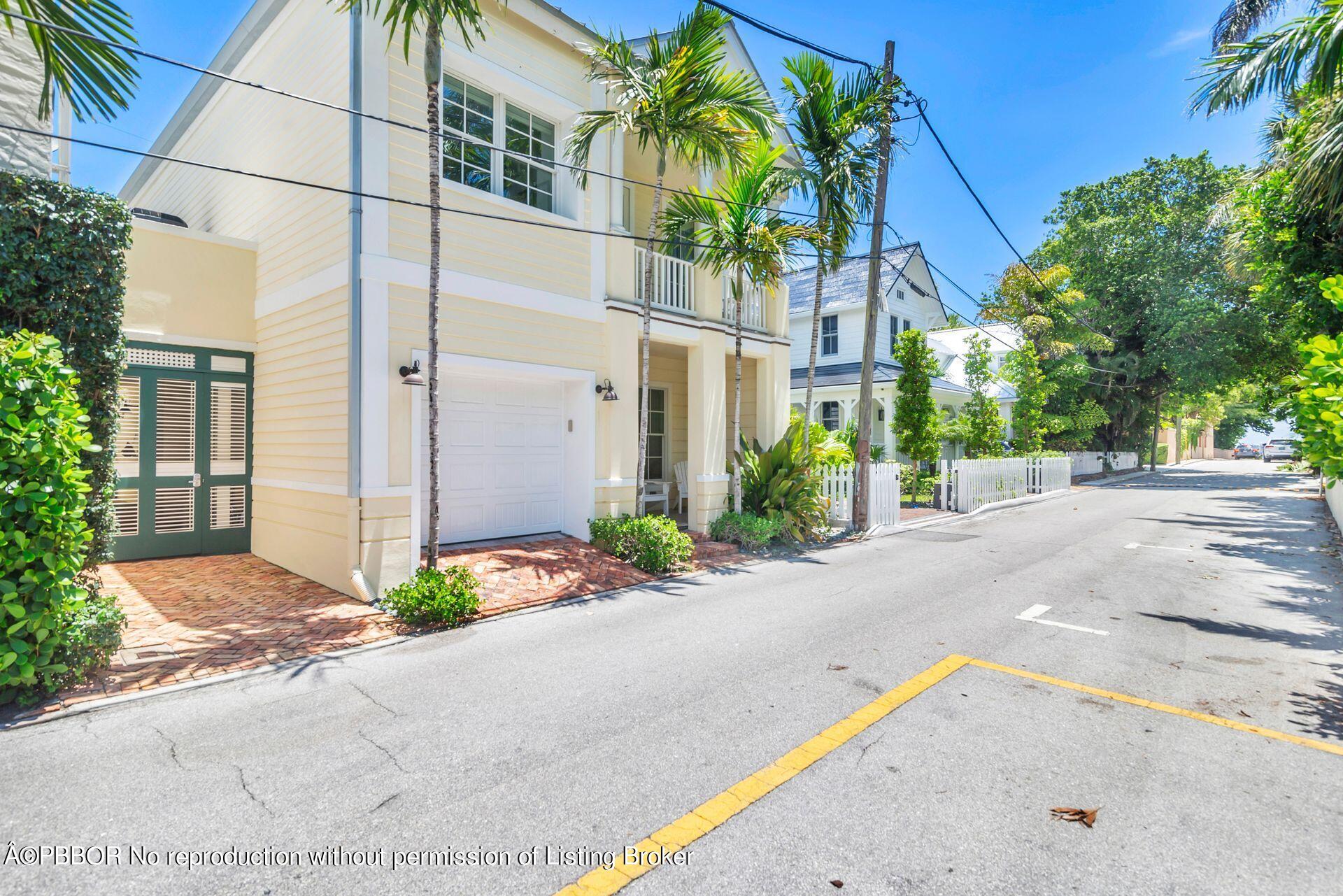 135 Root Trail, Unit A Palm Beach, FL 33480 - Photo 3 of 25 a view of a street with a building in front of it