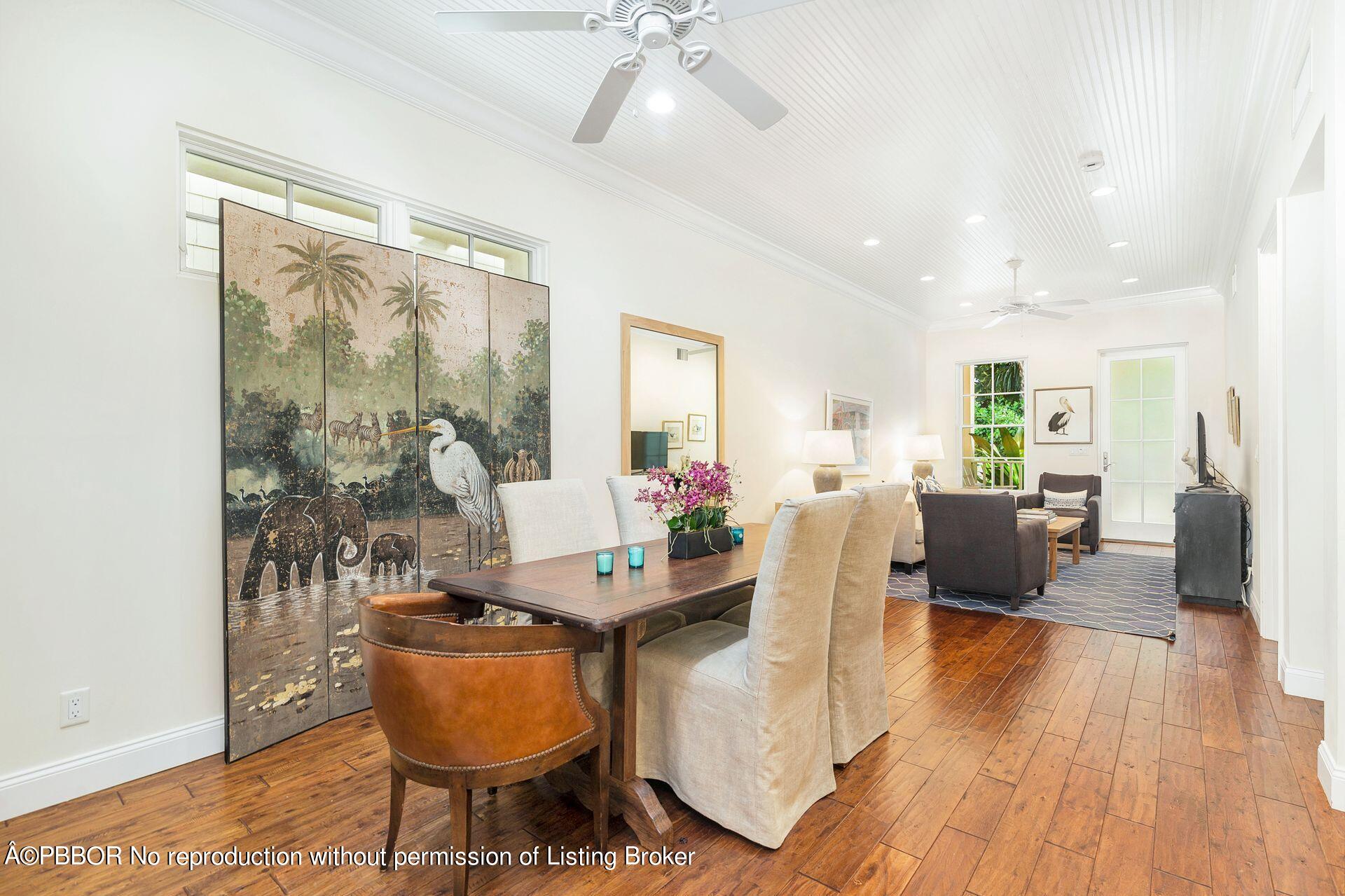 135 Root Trail, Unit A Palm Beach, FL 33480 - Photo 7 of 25 a living room with furniture and a large window