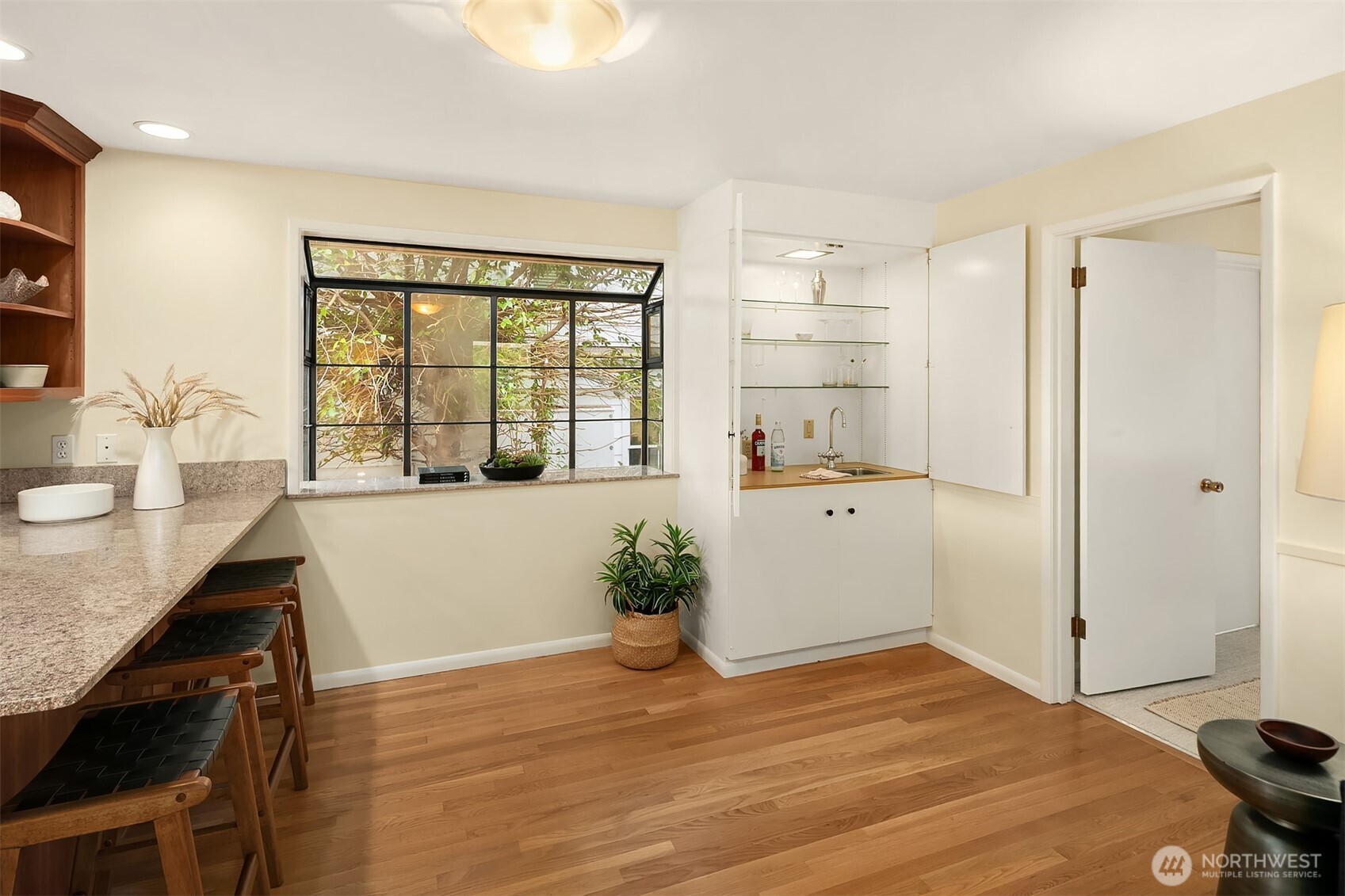 6555 Northeast Windermere Road Seattle, WA 98105 - Photo 16 of 38 a bedroom with a bed and a large window