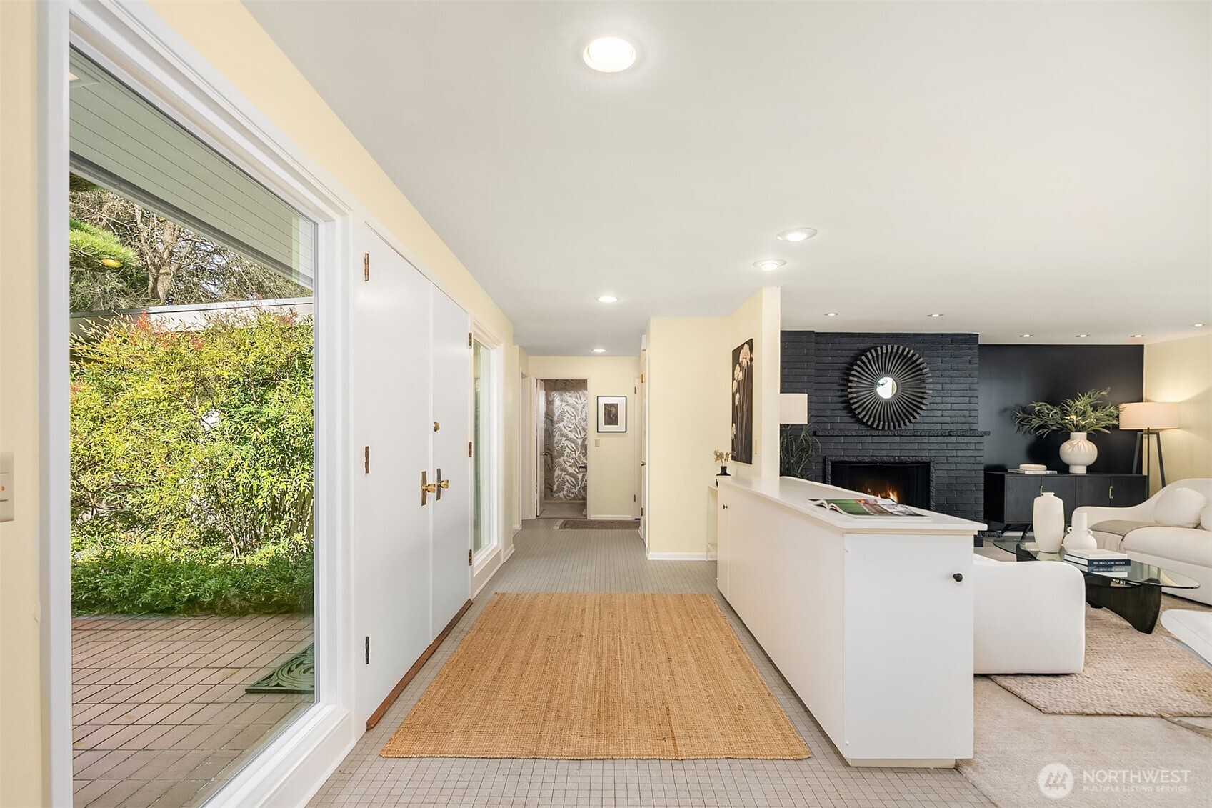 6555 Northeast Windermere Road Seattle, WA 98105 - Photo 19 of 38 a living room with furniture and a flat screen tv