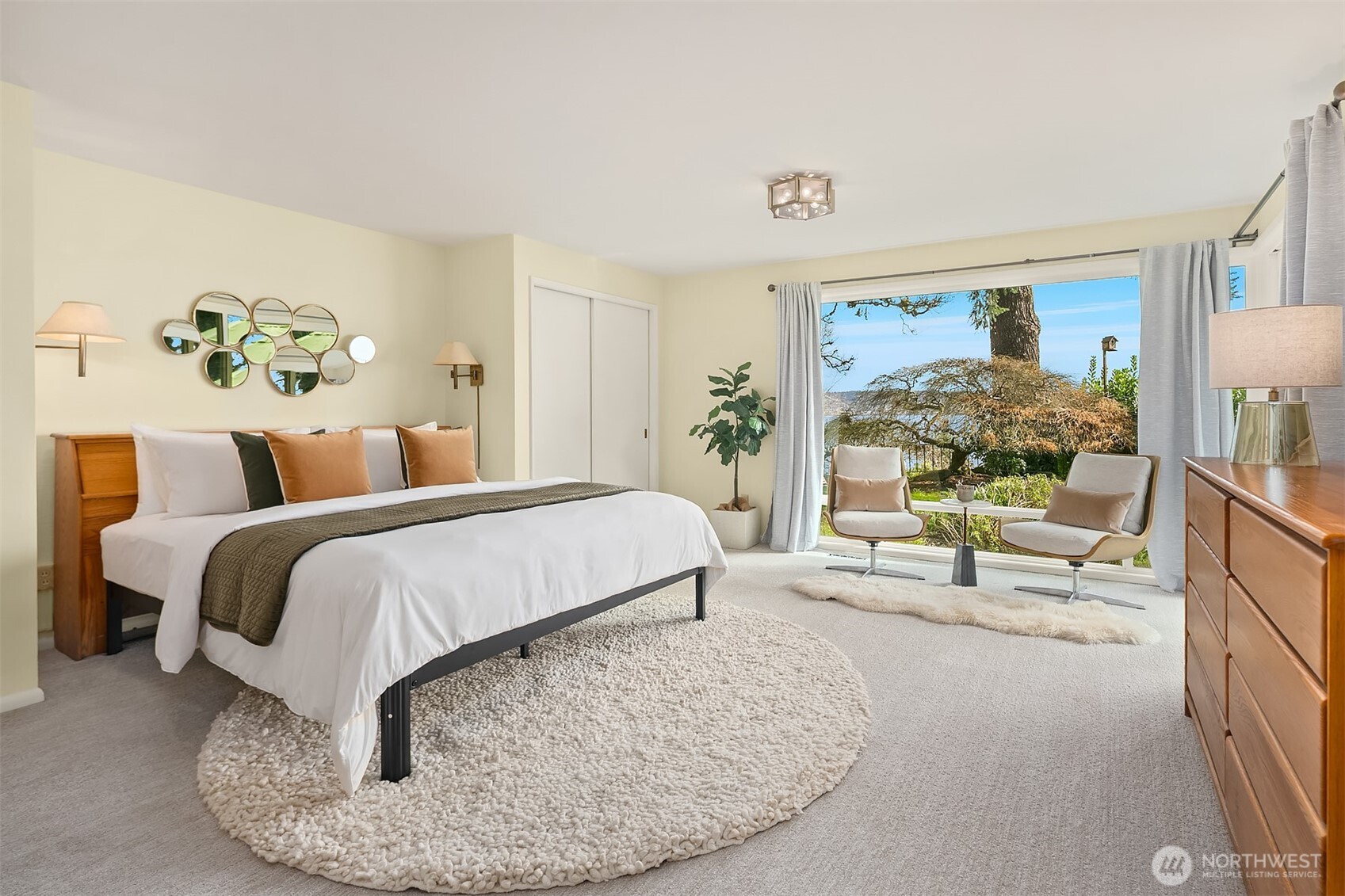 6555 Northeast Windermere Road Seattle, WA 98105 - Photo 20 of 38 a spacious bedroom with a bed and window