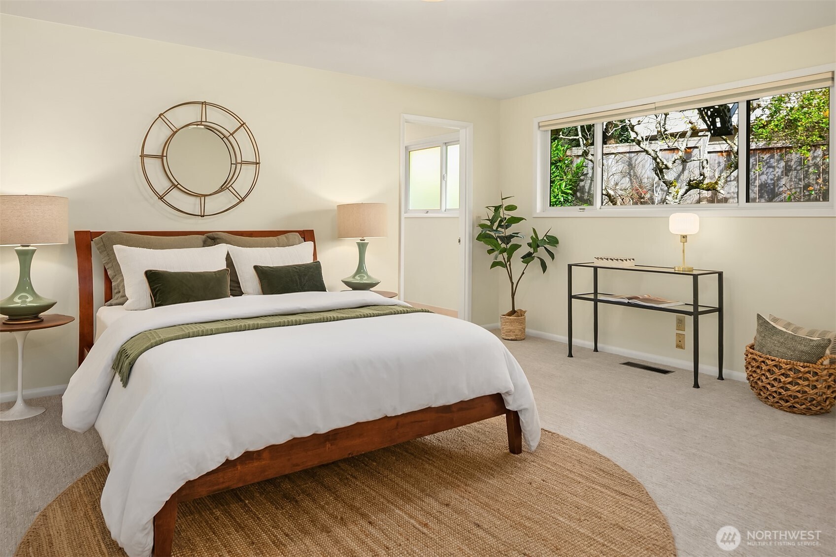 6555 Northeast Windermere Road Seattle, WA 98105 - Photo 27 of 38 a bedroom with a bed and a large window