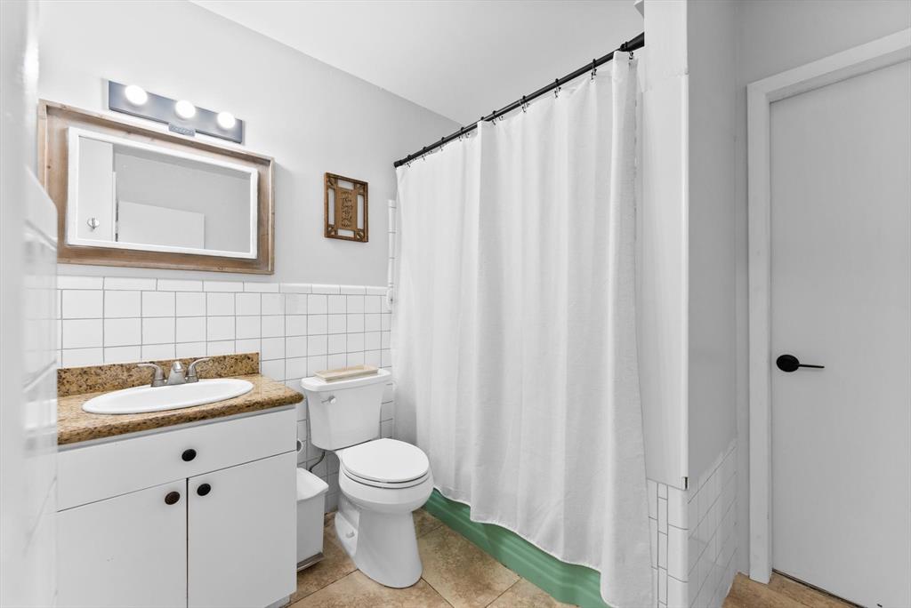 1257 Northwest 5th Street Boca Raton, FL 33486 - Photo 21 of 44 a bathroom with a toilet sink and mirror