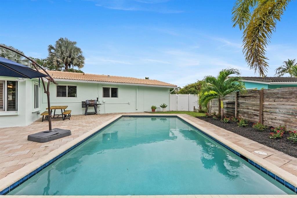 1257 Northwest 5th Street Boca Raton, FL 33486 - Photo 34 of 44 a view of a house with swimming pool
