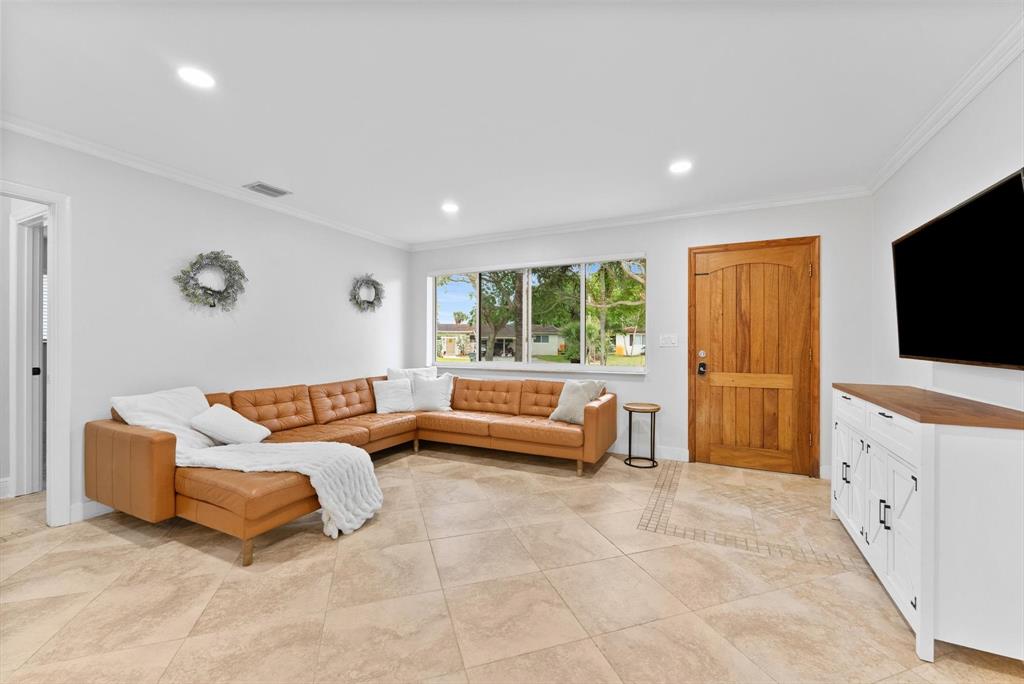 1257 Northwest 5th Street Boca Raton, FL 33486 - Photo 7 of 44 a living room with furniture and a flat screen tv
