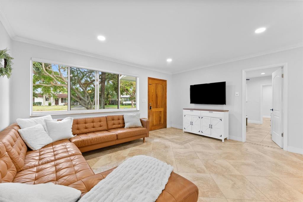 1257 Northwest 5th Street Boca Raton, FL 33486 - Photo 8 of 44 a living room with furniture and a flat screen tv