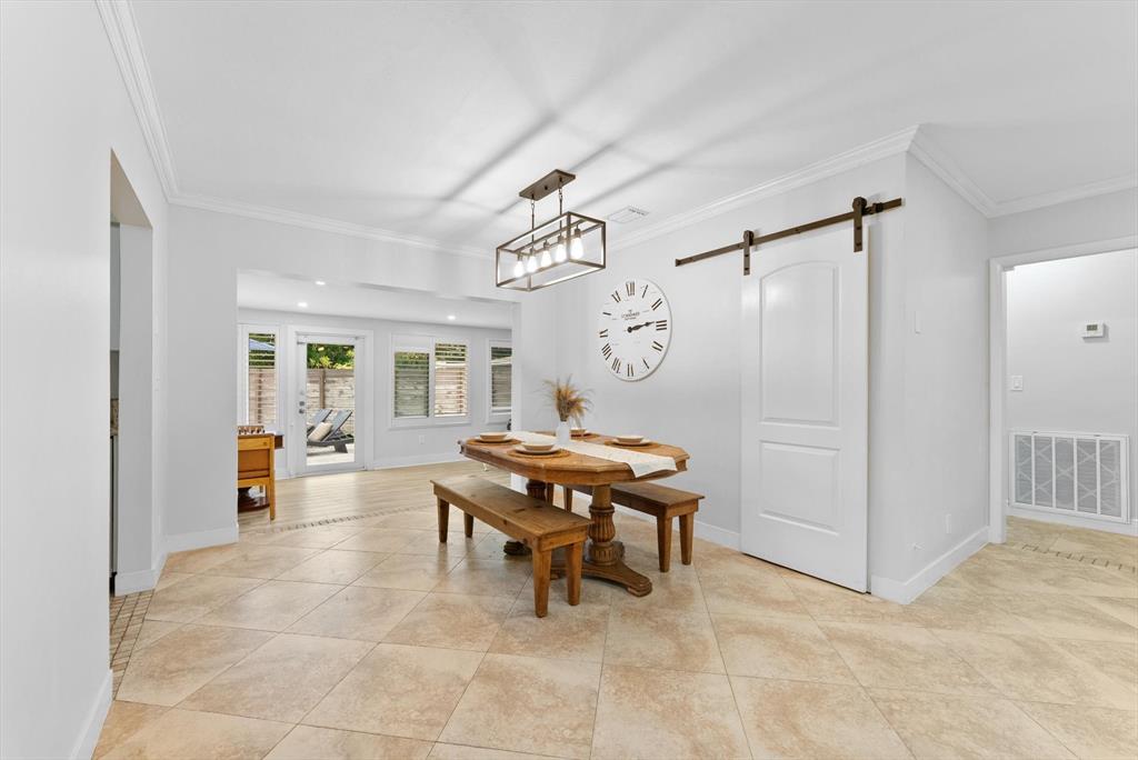 1257 Northwest 5th Street Boca Raton, FL 33486 - Photo 9 of 44 a living room with furniture a dining table and a chandelier