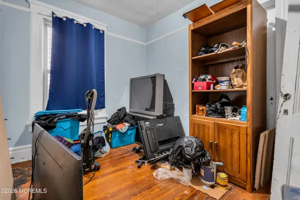a bed room with a bed and a window