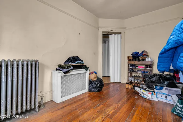 a bedroom with a bed and a mirror