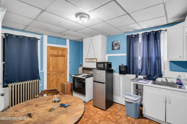 a view of a room that has a table and chair in it