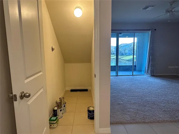 wooden floor with a bathroom