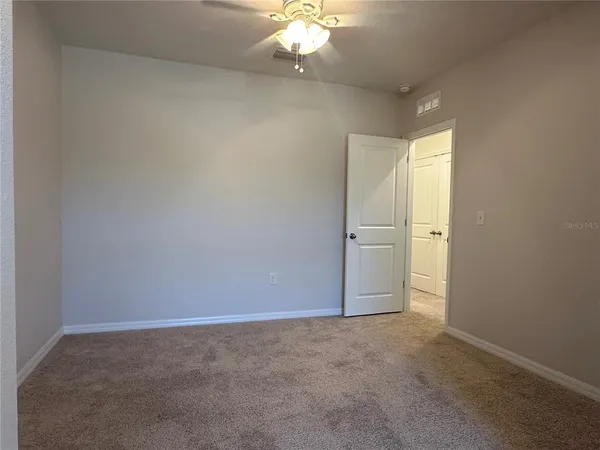 an empty room with a bathroom