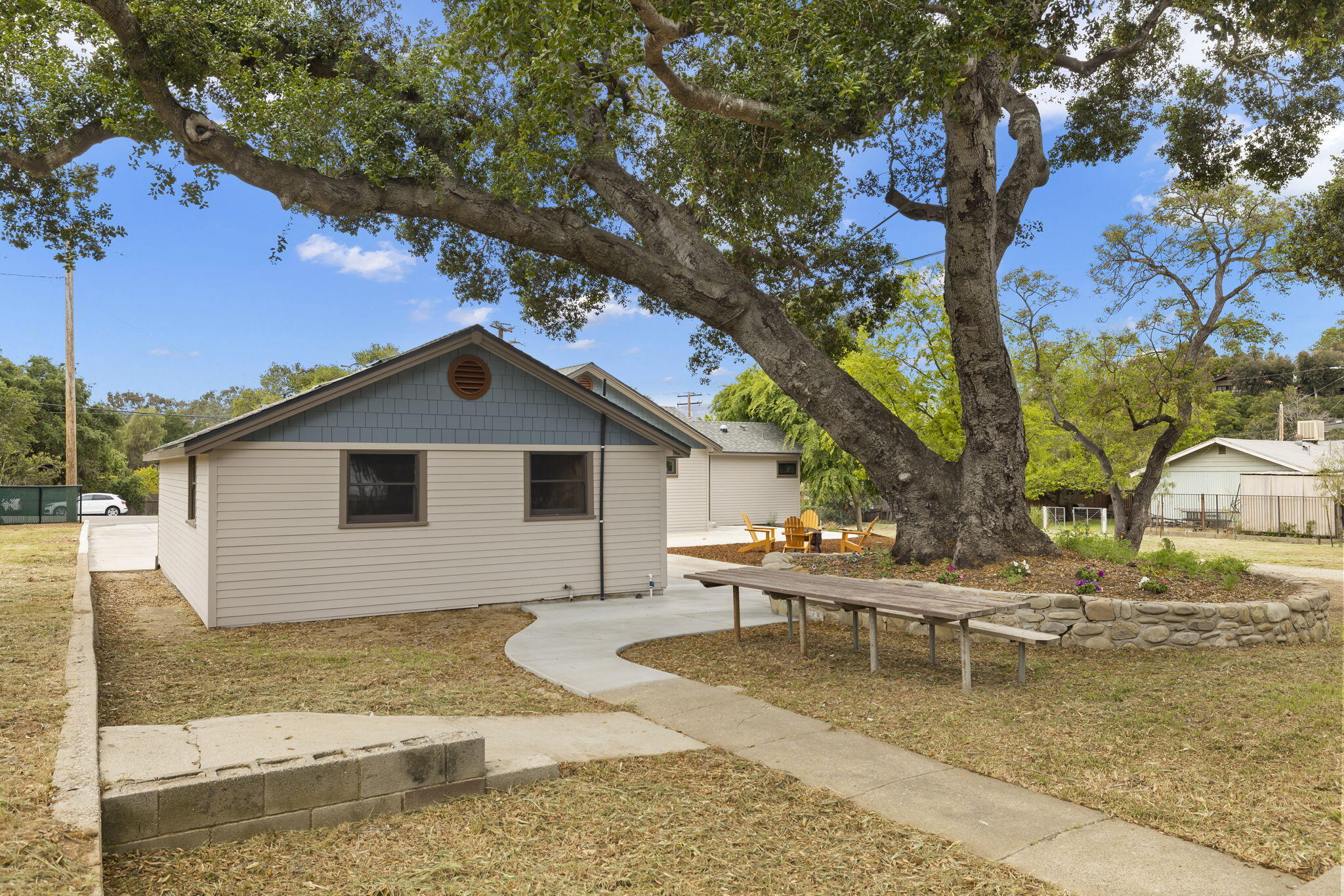 350 Old Grade Road Oak View, CA 93022 - Photo 19 of 59 a white house that has a tree in front of it