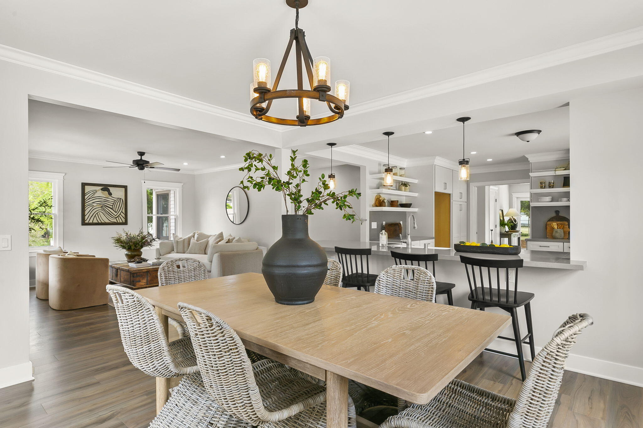 350 Old Grade Road Oak View, CA 93022 - Photo 27 of 59 a dining room with wooden floor a chandelier a wooden table and chairs
