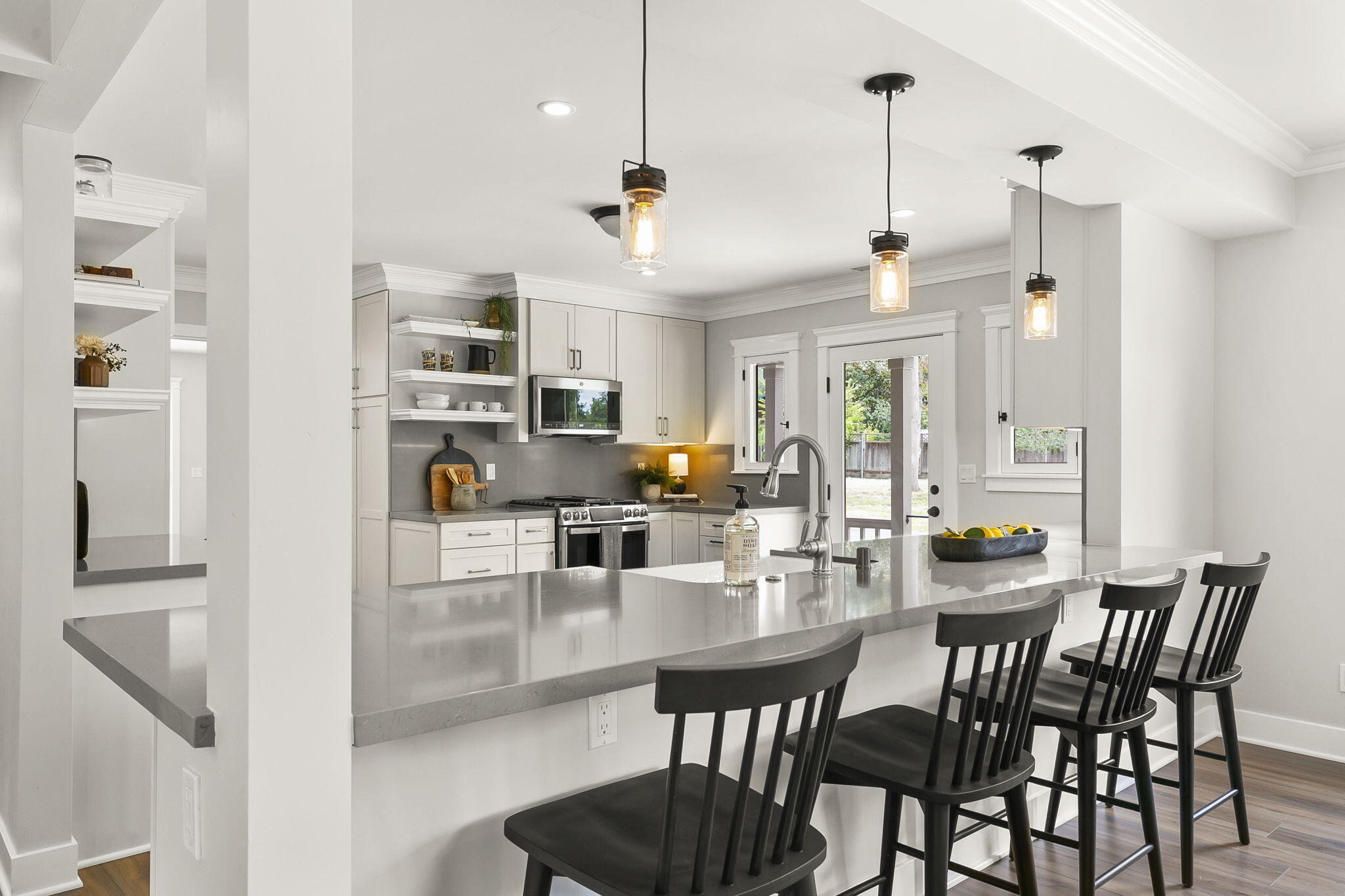 350 Old Grade Road Oak View, CA 93022 - Photo 28 of 59 a view of a dining room and livingroom with furniture wooden floor a chandelier