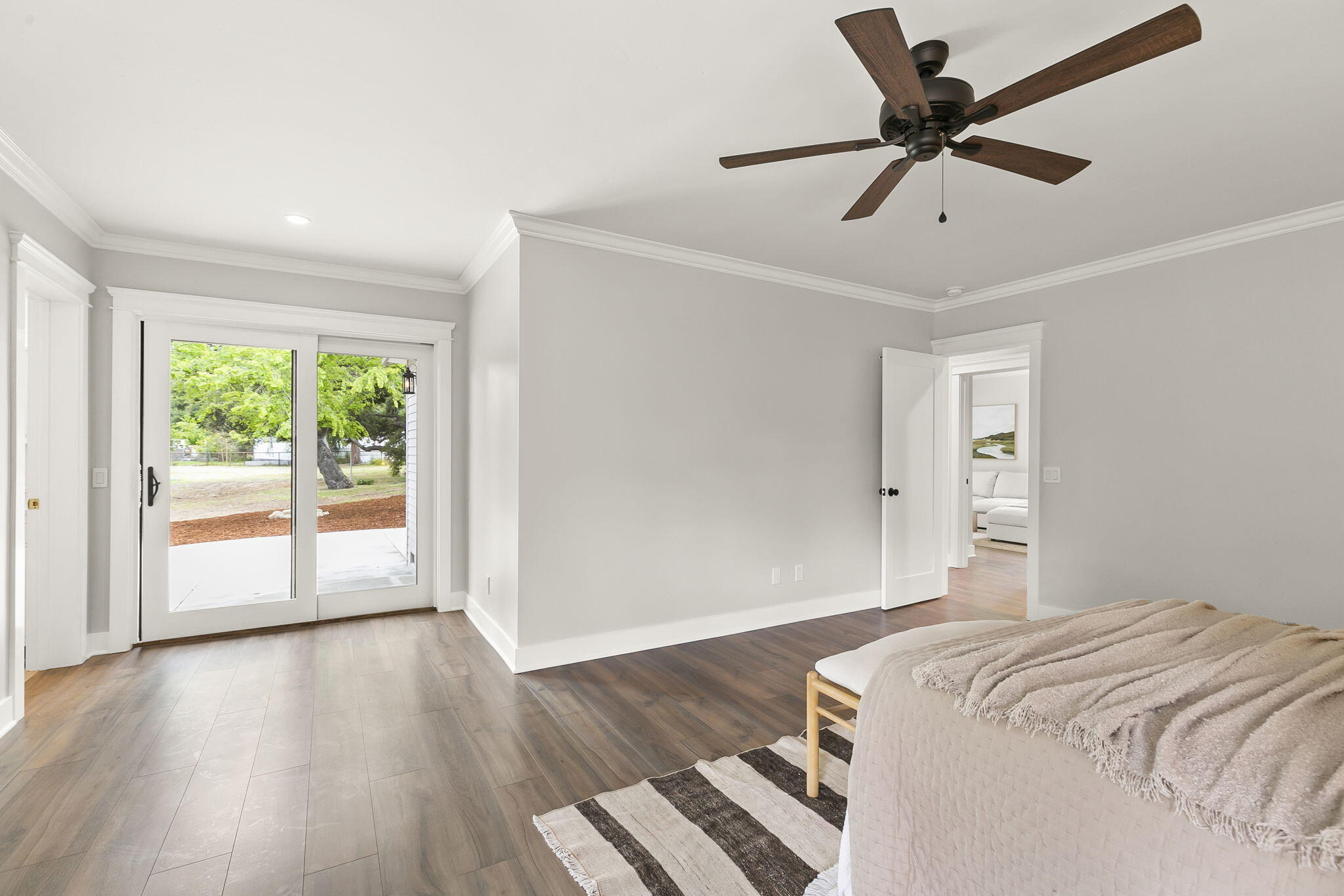 350 Old Grade Road Oak View, CA 93022 - Photo 35 of 59 a bedroom with a large bed and wooden floor